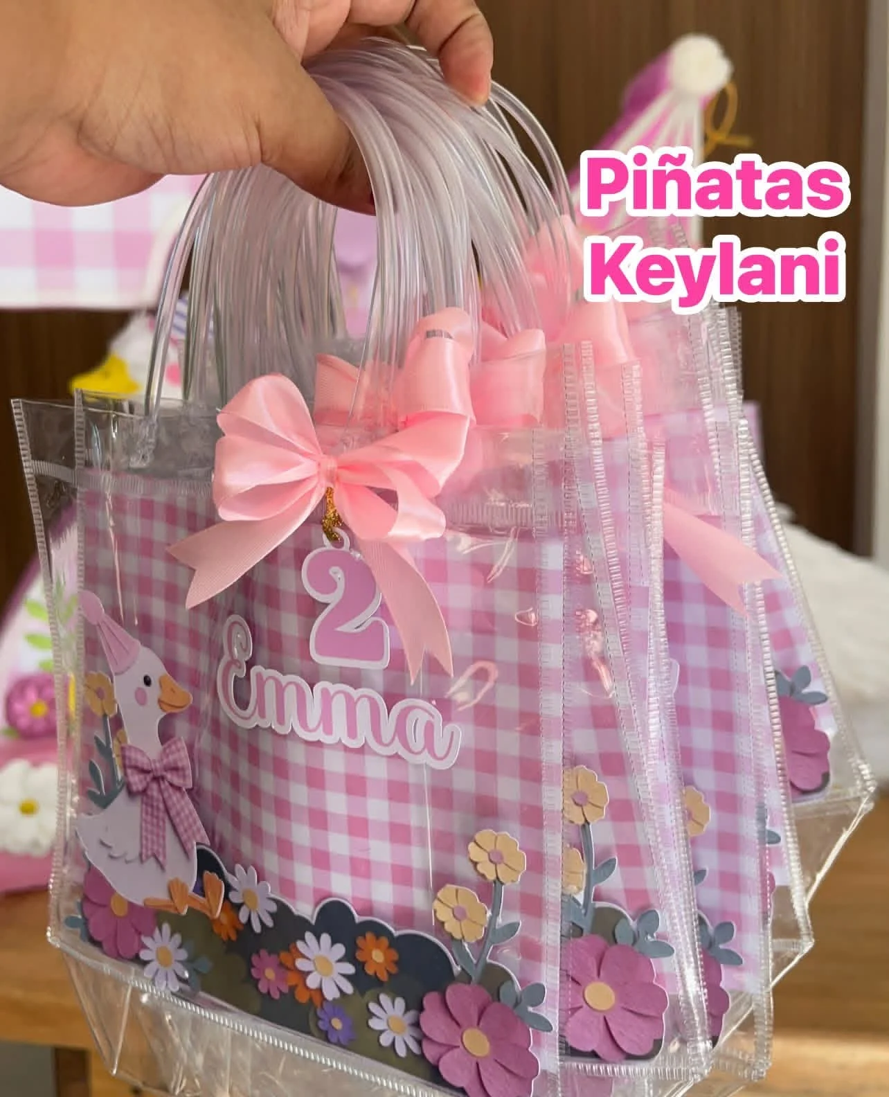 Bolsitas transparentes de patitos con moños rosas